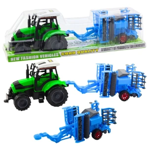Duży traktor rolniczy z ruchomą broną talerzową